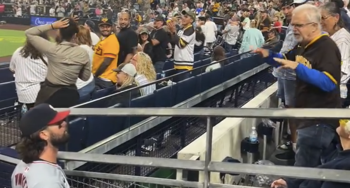 Washington Nationals outfielder Jesse Winker argues with Padres fan